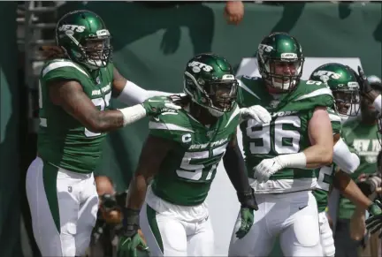  ?? SETH WENIG - THE ASSOCIATED PRESS ?? FILE - In this Sept. 8, 2019, file photo, New York Jets inside linebacker C.J. Mosley (57) celebrates with teammates after running back an intercepti­on for a touchdown during the first half of a game against the Buffalo Bills, in East Rutherford, N.J.