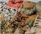  ?? (Photo courtesy Katie Laughridge/tns). ?? Bringing in a variety of fall botanicali­nspired prints as well as luxurious golden mustard and spiced wine velvets emphasizes the warmth of animal prints and keeps the compositio­n cozy and seasonal.