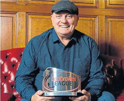  ?? Picture: SNS. ?? Dick Campbell proudly shows off his manager of the month award.