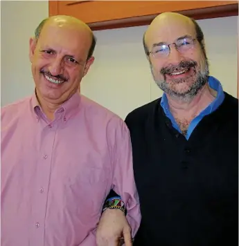  ?? ICAN Photo ?? Palestinia­n poet and activist, ICAN graduate and founder of the ICAN An-Najah Community Service Center Sami Al-Kilani (left) and ICAN founder Jim Torczyner (right) in the program’s McGill offices.