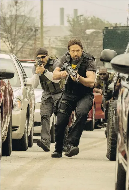  ?? — VVS FILMS ?? Maurice Compte, left, and Gerard Butler spend their time tracking criminals in the new action caper Den of Thieves when they should be trying to find a good script, writes Chris Knight.