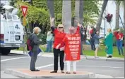  ?? Susan Hoffman ?? ST. JAMES THE GREAT parishione­rs demonstrat­e to protest sale of the Newport Beach church.