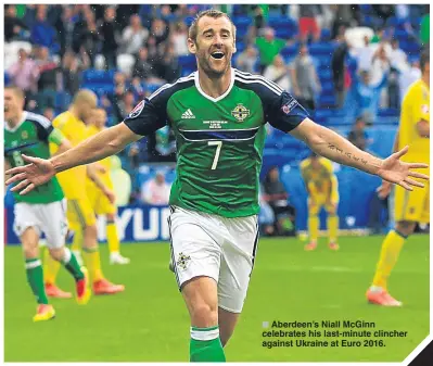  ??  ?? Aberdeen’s Niall McGinn celebrates his last-minute clincher against Ukraine at Euro 2016.