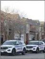  ?? (AP/The Canadian Press/Patrick Doyle) ?? Police vehicles are parked at the scene where six people were found dead in the Barrhaven suburb of Ottawa on Thursday.