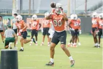  ?? MIKE STOCKER/SOUTH FLORIDA SUN SENTINEL ?? Miami tight end Elijah Arroyo goes through drills during the first fall training camp practice on Aug. 5. Arroyo did not warm up with the Hurricanes before their game against North Carolina on Saturday.