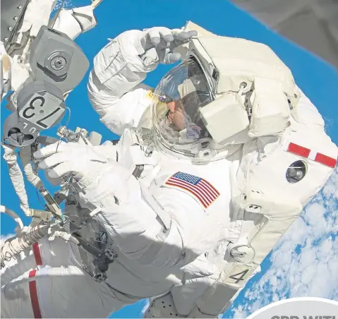  ??  ?? Doctor Tom Marshburn takes a space walk outside the Internatio­nal Space Station in 2009