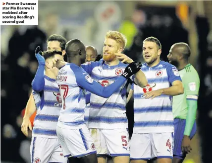  ??  ?? > Former Swansea star Mo Barrow is mobbed after scoring Reading’s second goal