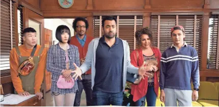  ?? COLLEEN HAYES/NBC ?? In “Sunnyside,” Kal Penn, center, is Garrett Modi, a disgraced New York City councilman who hopes to find redemption by helping immigrants try to become American citizens.