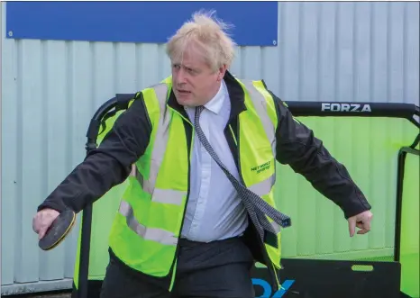  ?? Picture: PA ?? Boris Johnson plays table tennis during a visit to Next World Sports, in Wrexham, yesterday