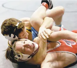  ?? STEVE EARLEY/STAFF ?? Riley Parker of First Colonial pins Nolan McEachin of Fauquier at 113 pounds Saturday in American Division competitio­n at the Virginia Duals at Hampton Coliseum.