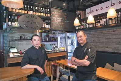  ?? GAO ER’QIANG / CHINA DAILY ?? Australian Chinese Anthony Chow (left) and Singaporea­n Joey Cheong run a bistro in Shanghai, which offers a selection of tapas-style dishes from different cuisines around the world.