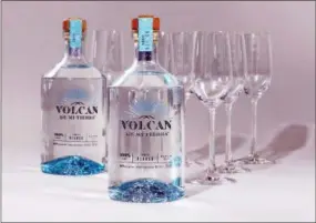  ?? RICHARD DREW — THE ASSOCIATED PRESS ?? 750ml bottles of Volcan De Mi Tierra Blanco tequila, and Riedel Ouverture Tequila Glasses. The new distillery combines old-world traditions with contempora­ry technique and mixes 75% slow-roasted lowlands agave with 25% highlands agave.