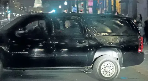  ?? ALEX BRANDON/ THE ASSOCIATED PRESS FILES ?? In this March 25 file photo, U. S. President Donald Trump and his motorcade turns onto Pennsylvan­ia Avenue as he returns to the White House after dinner at the Trump Internatio­nal Hotel in Washington.