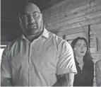  ?? PROVIDED BY UNIVERSAL PICTURES ?? Leonard (Dave Bautista) and friends disrupt a family’s vacation with a dreadful choice in M. Night Shyamalan’s thriller “Knock at the Cabin.”