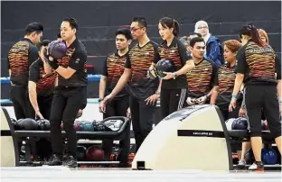  ??  ?? Hard at work: Malaysian bowlers at a training session at the Sunway Mega Lanes in Subang Jaya yesterday.