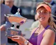  ?? AFP ?? Elina Svitolina of Ukraine poses with the trophy after winning the Italian Open final against Simona Halep of Romania. —