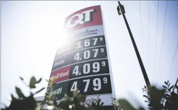  ?? MICHAEL NOBLE JR./TULSA WORLD VIA AP ?? Tulsa continues to have the lowest average gasoline price in the U.S. amid many areas of the country with prices well over $4 per gallon. during a public event on March 28 at a Quick Trip in Tulsa, OK.