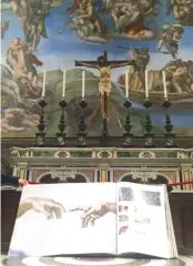  ??  ?? A 1:1 scale photograph­ic book depicting Sistine Chapel is seen during a news conference in the Sistine Chapel, the Vatican on Feb. 24.