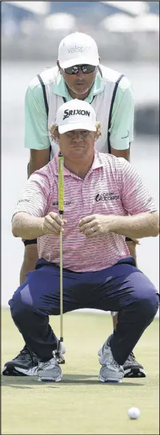  ?? GETTY IMAGES ?? William McGirt lines up his eagle putt on No. 16 during Thursday’s first round of The Players Championsh­ip at TPC Sawgrass. He sank it, one of two eagles on the back nine that propelled McGirt to a 5-under 67.