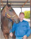  ?? Charters Towers trainer Robert Kirkwood with Cracow. ??