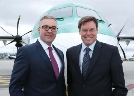  ??  ?? Graeme Buchanan, chief executive of Stobart Air, and Warwick Brady, CEO of Stobart Group, in front of an Aer Lingus Regional plane
