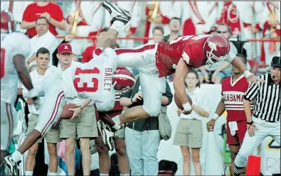  ?? Democrat-Gazette file photo ?? Arkansas tight end Joe Dean Davenport dives into the end zone for a touchdown during the second quarter of the Razorbacks’ 42-6 victory in 1998. It was the Tide’s worst defeat since losing to Auburn 40-0 in 1957, the last game before Bear Bryant became...