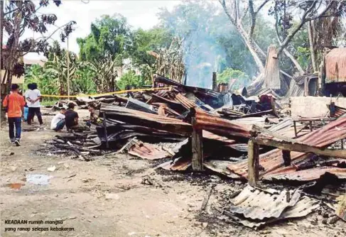  ??  ?? KEADAAN rumah mangsa yang ranap selepas kebakaran.