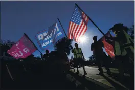  ?? ASHLEY LANDIS — THE ASSOCIATED PRESS ?? People attend a rally in support of President Donald Trump outside Thousand Oaks City Hall on Wednesday.