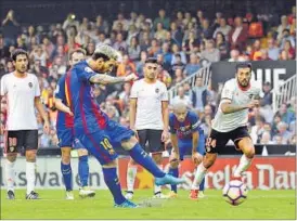  ?? AP ?? Lionel Messi scores a penalty during the Spanish La Liga match between Valencia and FC Barcelona in Valencia on Saturday.