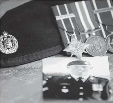  ??  ADRIAN WYLD/THE CANADIAN PRESS ?? Cpl. Stuart Langridge is seen in a photo, along with his beret and medals. A long-awaited report into whether the military botched its investigat­ion into the suicide of Langridge, a troubled young soldier, will be released Tuesday.