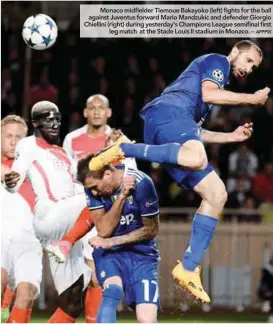  ??  ?? Monaco midfielder Tiemoue Bakayoko (left) fights for the ball against Juventus forward Mario Mandzukic and defender Giorgio Chiellini (right) during yesterday’s Champions League semifinal first leg match at the Stade Louis II stadium in Monaco. –