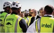  ?? NEW YORK TIMES PHOTO ?? President Joe Biden greets constructi­on workers during a tour of a new Intel semiconduc­tor manufactur­ing facility site in New Albany, Ohio, on Sept. 9, 2022. The plant is part of Biden’s efforts toward rebuilding American manufactur­ing through the CHIPS and Science Act.