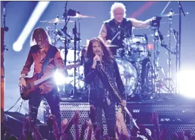  ?? Photos and text from wire services ?? Tom Hamilton, Steven Tyler and Joey Kramer of Aerosmith