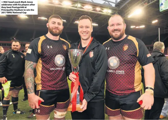  ??  ?? &gt; RGC head coach Mark Jones celebrates with his players after they beat Pontypridd at Principali­ty Stadium to win the 2017 WRU National Cup