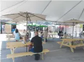  ?? David Wilson/appeal-democrat ?? Customers of the Happy Viking in Yuba City on Friday sitting in an outdoor area set up behind the restaurant.