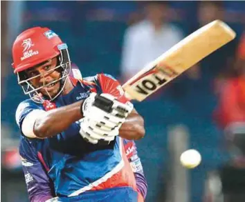  ?? AFP ?? Delhi Daredevils’ Sanju Samson in an aggressive mood during his 63-ball century against Rising Pune Supergiant yesterday. It was the first century of IPL X.