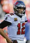  ?? MARK LOMOGLIO/AP ?? Tampa Bay Buccaneers quarterbac­k Tom Brady is under contract for 2022 but his return isn’t definite.