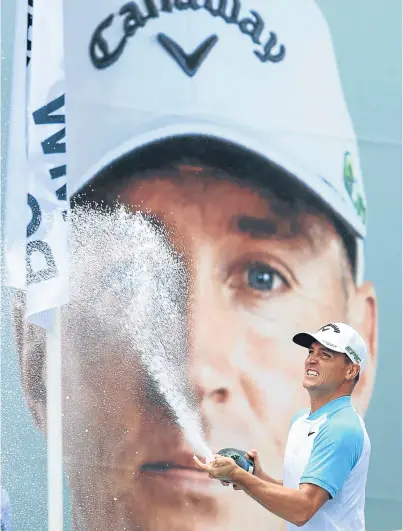  ??  ?? Alex Noren of Sweden celebrates after his dramatic win in the BMW PGA Championsh­ip at Wentworth.