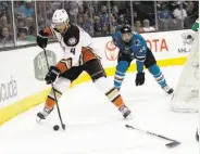  ?? Marcio Jose Sanchez / Associated Press ?? The Ducks’ Cam Fowler (left) skates past the Sharks’ Marc-Edouard Vlasic in the first period.