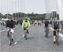  ??  ?? Cyclists on the bridge. Pictures by Chris Booth.