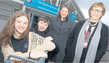  ??  ?? SUCCESS: S4 pupils Logan Parker and Jake Weston with Aileen Campbell and Growing2ge­ther director Diana Whitmore