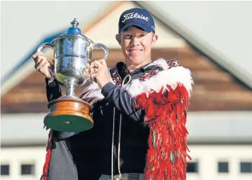  ?? PHOTOSPORT NZ ?? Brad Kennedy poses with the New Zealand Open trophy.
