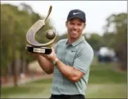  ?? MIKE CARLSON - AP ?? Paul Casey holds up the champion’s trophy after winning the Valspar Championsh­ip golf tournament Sunday in Palm Harbor, Fla.