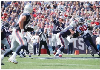  ??  ?? New England Patriots quarterbac­k Tom Brady (12) throws a pass to tight end Rob Gronkowski (87) against the Houston Texans in the second quarter at Gillette Stadium on Sunday. (USA TODAY Sports)