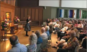  ?? RICHARD PAYERCHIN — THE MORNING JOURNAL ?? Organist Katelyn Emerson addresses the audience at First Lutheran Church, where she played in the dedication recital of the church’s new organ on Aug. 25. The new organ, built by Paul Fritts & Co. of Tacoma, Wash., replaces the organ destroyed in the fire of Aug. 28, 2014.