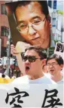  ?? TORU YAMANAKA AFP ?? Une manifestat­ion, en 2014, demandant la libération de Liu Xiaobo