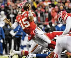 ?? JOHN SLEEZER / KANSAS CITY STAR ?? Chiefs quarterbac­k Patrick Mahomes, who is right-handed, attempts a left-handed pass while in the grasp of the Colts defense in an AFC divisional playoff game last weekend. Mahomes hasn’t shown any fear in trying unorthodox throws during his first season as a starter.