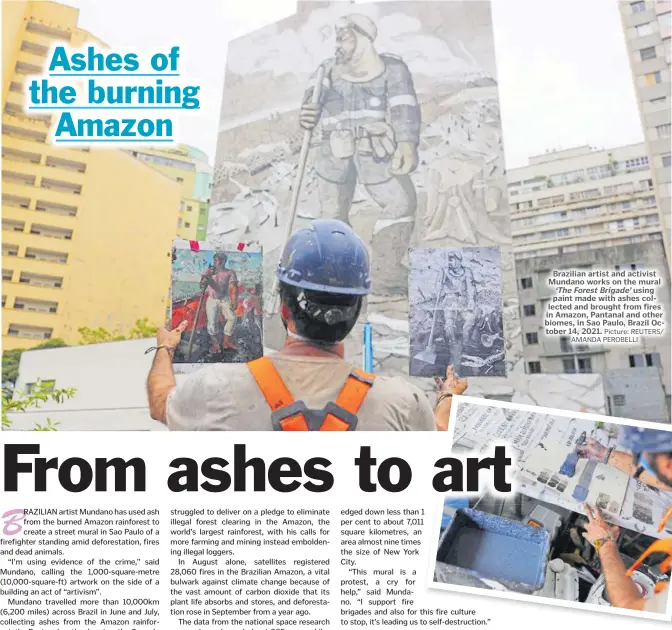  ?? Picture: REUTERS/ AMANDA PEROBELLI ?? Brazilian artist and activist Mundano works on the mural ‘The Forest Brigade’ using paint made with ashes collected and brought from fires in Amazon, Pantanal and other biomes, in Sao Paulo, Brazil October 14, 2021.