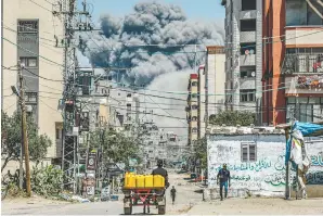  ?? AFPPIC ?? A cloud of smoke erupts following a blast in Nuseirat, central Gaza Strip on Wednesday. –