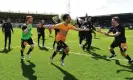  ?? ?? Cambridge United players celebrate on the final whistle. Photograph: Alan Walter/ Shuttersto­ck